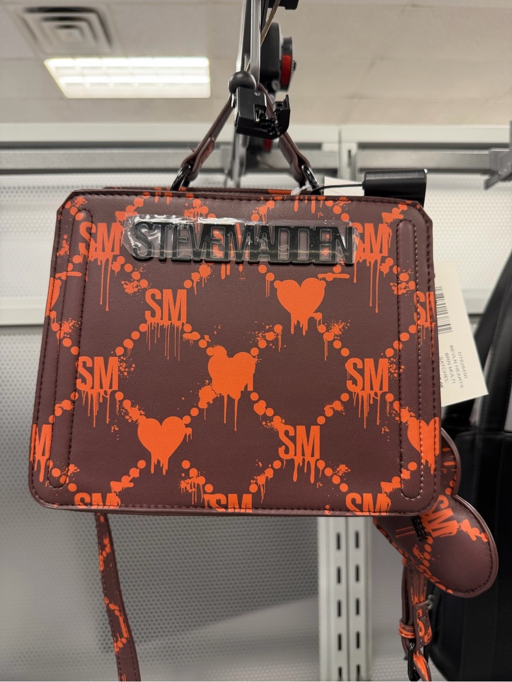 Steve Madden Bleeding Heart Bevln  Crossbody Bag in Brown with Orange Print